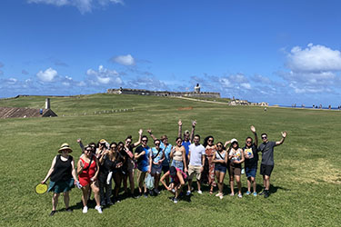 A group of students and staff pose together in Puerto Rico