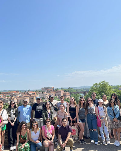 A group of people pose together in France