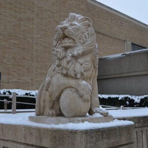 Lion statue covered in snow