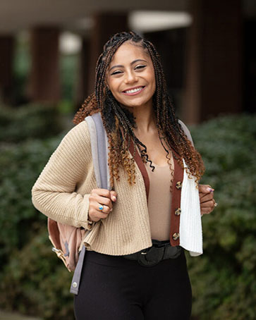 A student smiles on campus