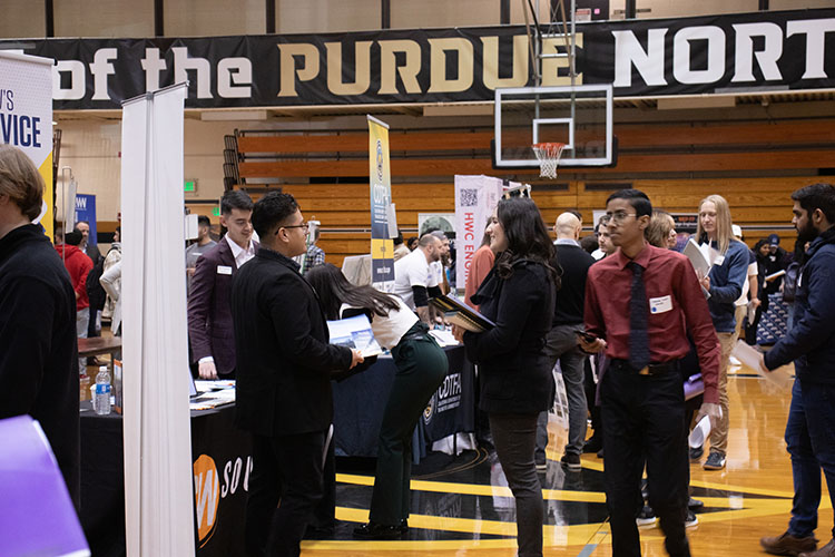 Vistors stroll through the Career Expo at Purdue University Northwest in the Fitness and Recreation Center building
