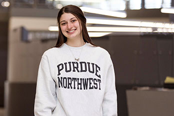 A PNW student in a Purdue Northwest sweatshirt.