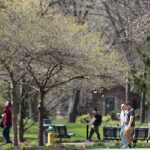 People walking across the campus