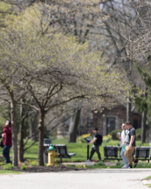 People walking across the campus