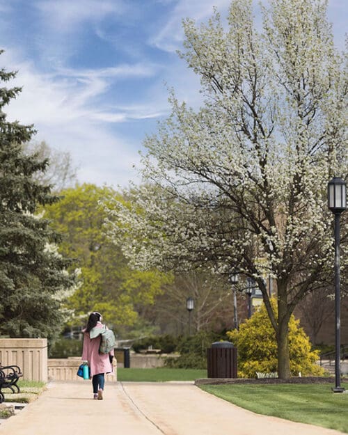 A student walks across PNW's Westville campus