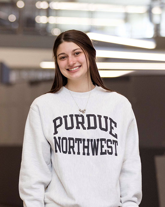 A female PNW student in a sweatshirt