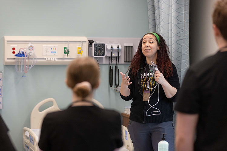 Nursing students in a lab space