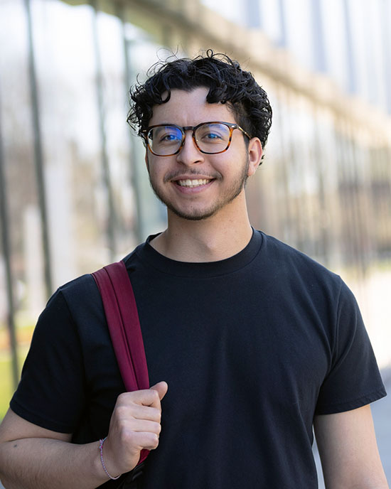 A PNW student wearing a backpack