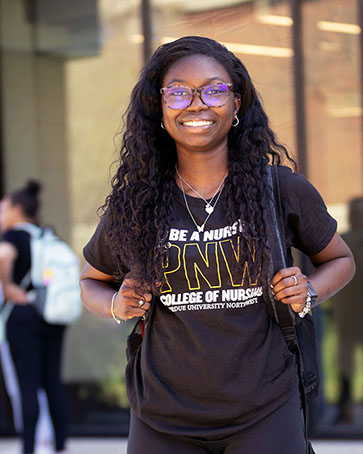 A PNW student in a College of Nursing t-shirt