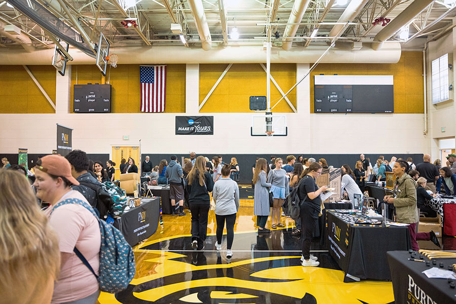 Students explores campus resources and student organizations in the H.D. Kiesling Gymnasium on PNW's Westville Branch Campus.