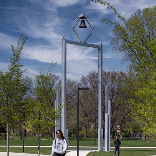 Students walk around the Bell Tower