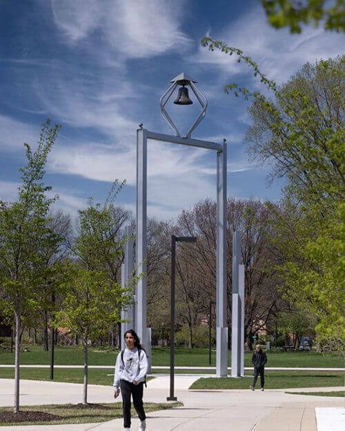 Students walk around the Bell Tower