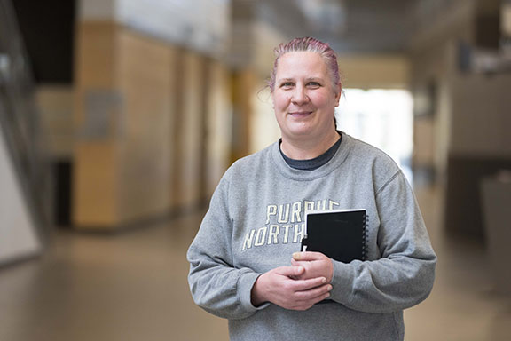 A student stands in the hallway on PNW's Westville branch campus