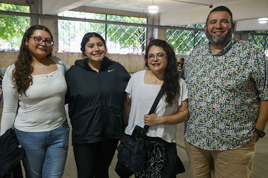 Four people pose together