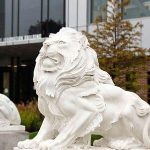 A lion sculpture outside the Nils K. Nelson Bioscience Innovation Building