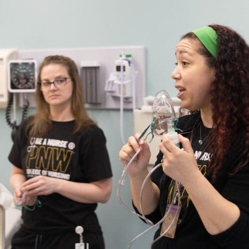 PNW nursing students learn in a simulated care facility.