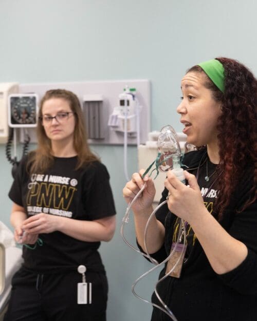 PNW nursing students learn in a simulated care facility.