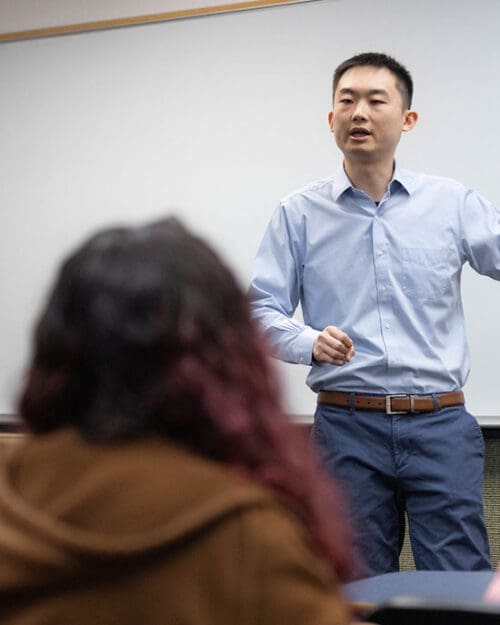 A PNW professor speaks in a classroom