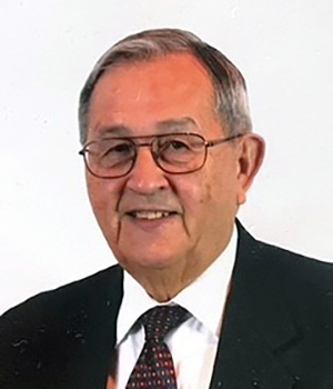 Headshot of PNW Chancellor Emeritus James Yackel in a suit and tie