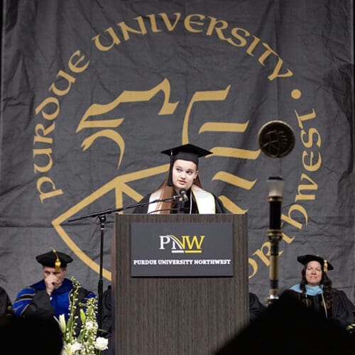 Chloe Belford speaks during Commencement